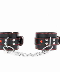 KINK - MUÑEQUERAS NEGRO CON INCRUSTACIÓN DE CORAZÓN ROJO AJUSTABLE 21-28 CM X 5.5 CM