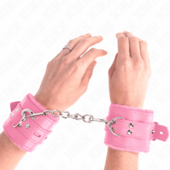 KINK - MUÑEQUERAS FORRADAS CON AGUJEROS CUADRADOS ROSA Y CORREA ROSA AJUSTABLE 17-29 CM X 6 CM - piKanteo | Despierta tu lado más piKante