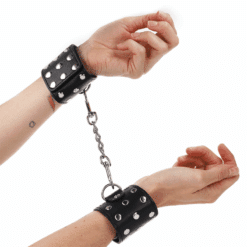 Comprar KINK - MUÑEQUERAS CON CIERRE A PRESIÓN LLENO DE TACHUELAS AJUSTABLE NEGRO 19-24 CM X 5.5 CM al mejor precio - Envíos Discretos