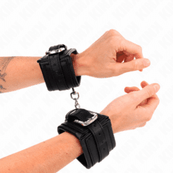 Comprar KINK - MUÑEQUERAS NEGRO CON HEBILLA DE DIAMANTES DE IMITACIÓN AJUSTABLE 25-32 CM X 5.5 CM al mejor precio - Envíos Discretos